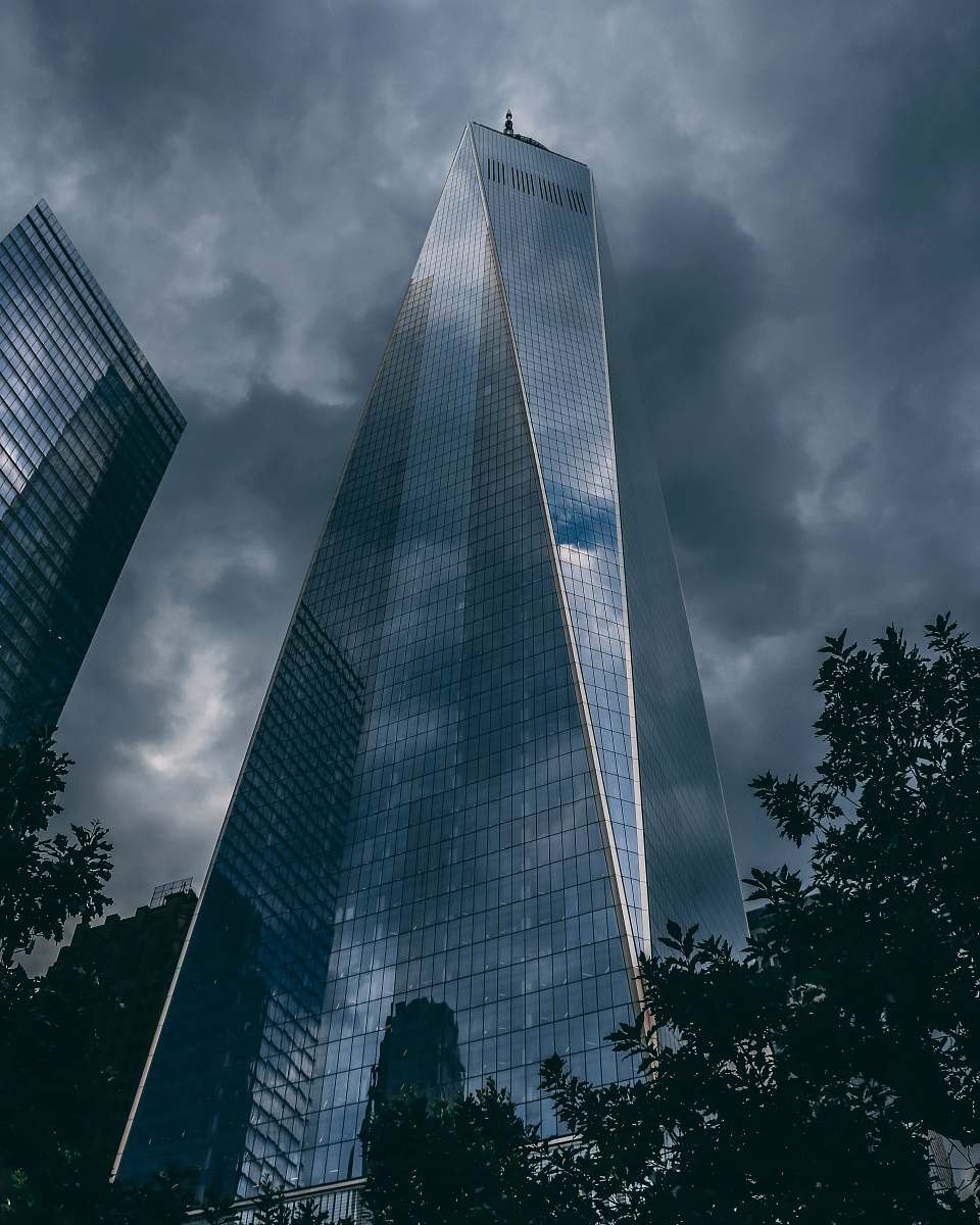 office building curtain wall building under cloudy sky town